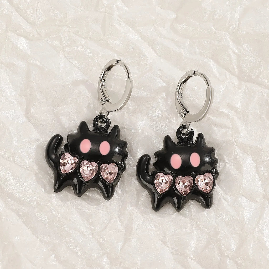 Women's alloy cross crystal earrings in five designs: white cross, peach heart, black cat, antique silver star.