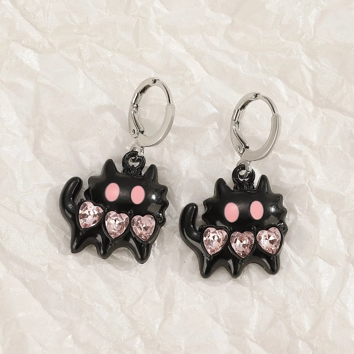 Women's alloy cross crystal earrings in five designs: white cross, peach heart, black cat, antique silver star.
