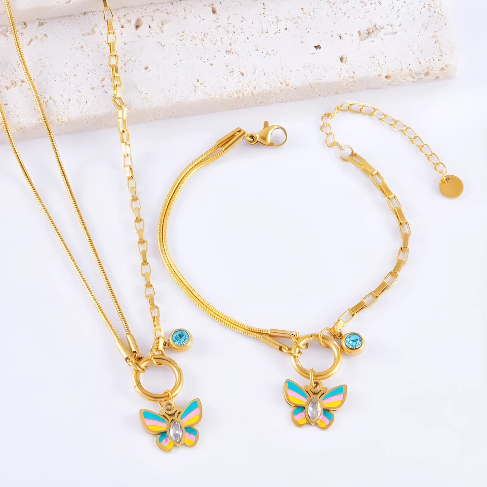 Gold titanium steel butterfly jewellery set with necklace and bracelet on snake bone chains