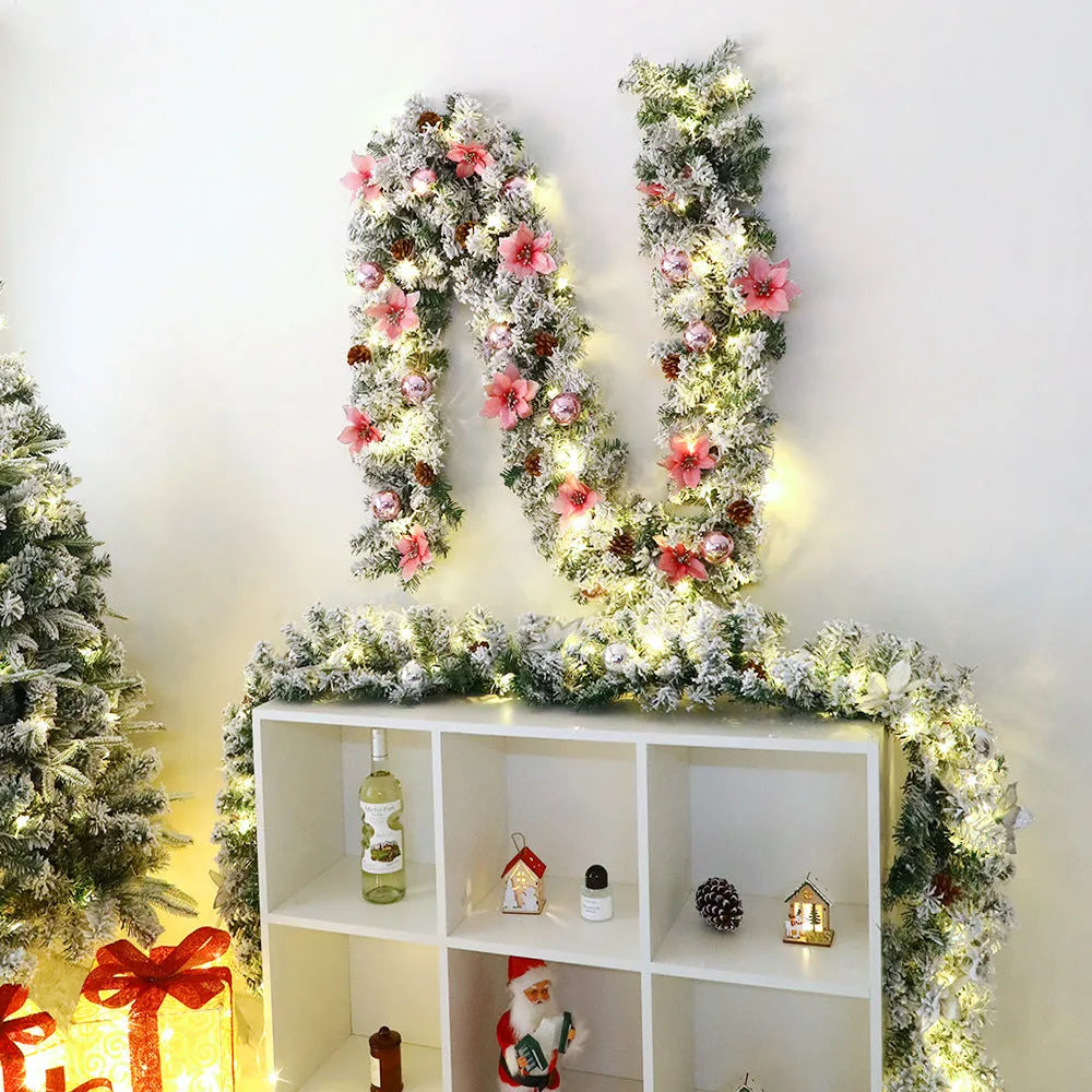 PVC Christmas rattan garland with flocking in golden colour, draped decoratively.
