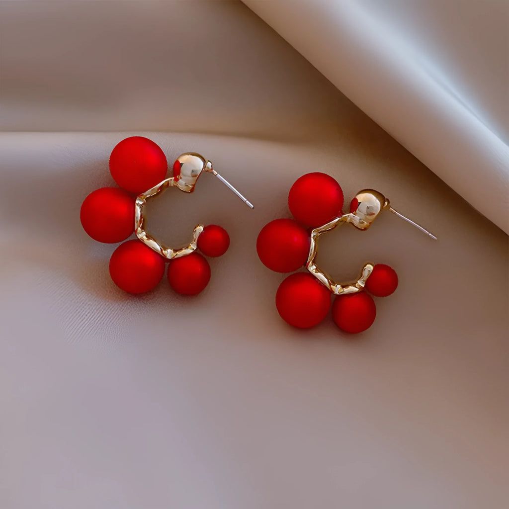 Red alloy bell earrings with decorative charm for women