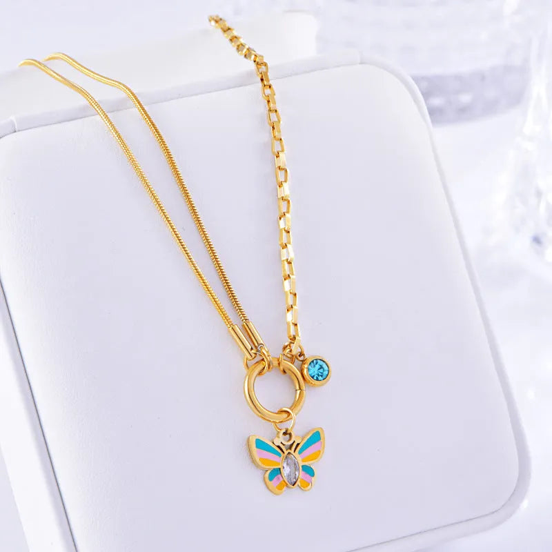 Gold titanium steel butterfly jewellery set with necklace and bracelet on snake bone chains
