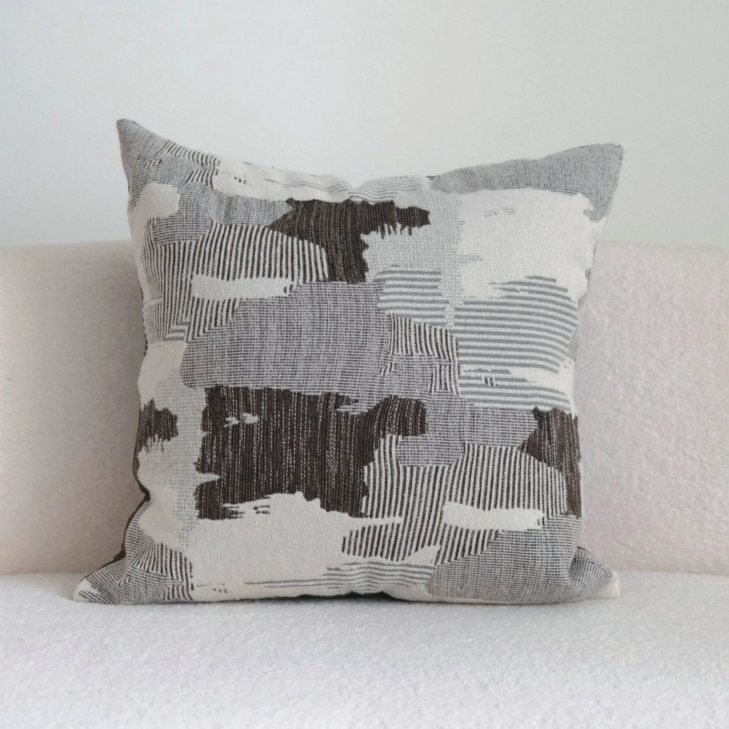 Coffee brown striped Chinese classical style decorative sofa cushion on a grey sofa.
