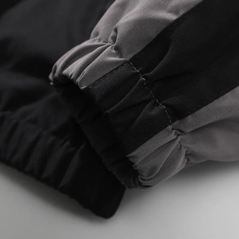 Men's black contrast stitch casual jacket with side seam pockets showing loose fit design