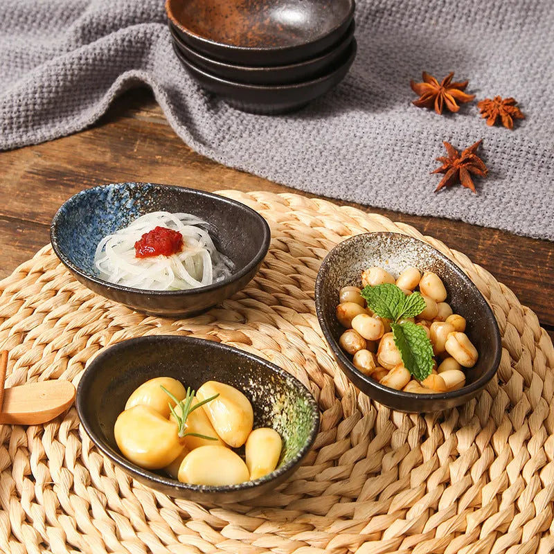 Oval Japanese ceramic sauce dipping bowl with underglaze finish in decorative pattern
