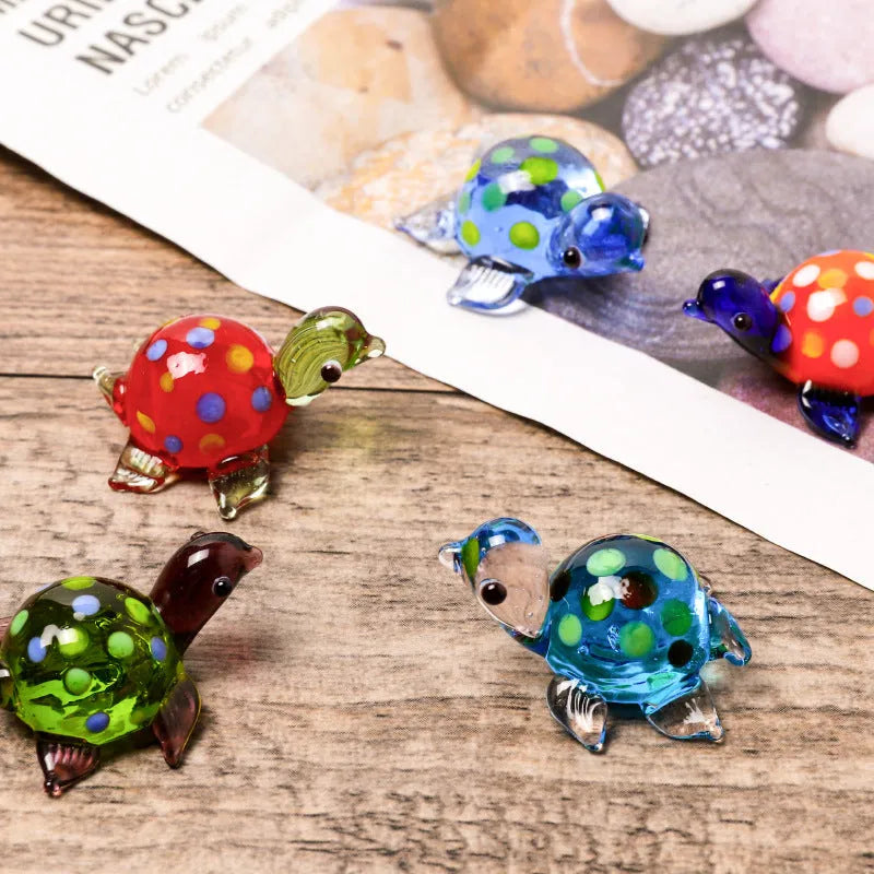 Geometric glass turtle desktop ornament in modern simplicity style on a wooden surface.