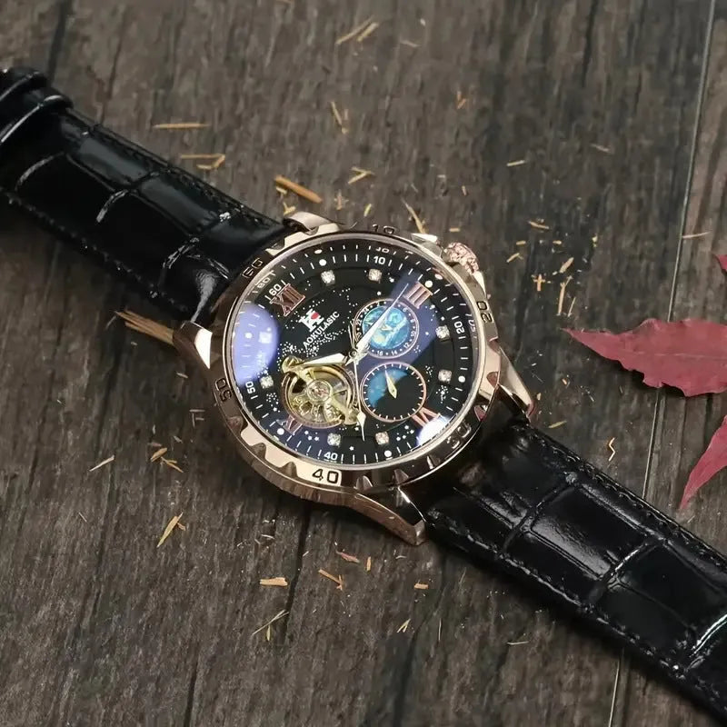Men's black and rose gold automatic watch with hollow skeleton dial on a leather strap.