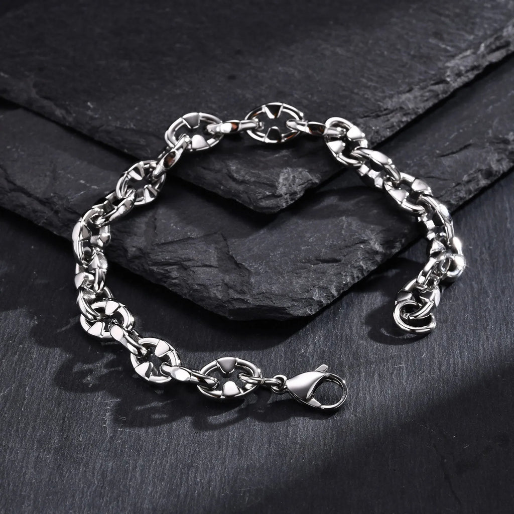 Thick handmade stainless steel chain bracelet with geometric links, steel colour.