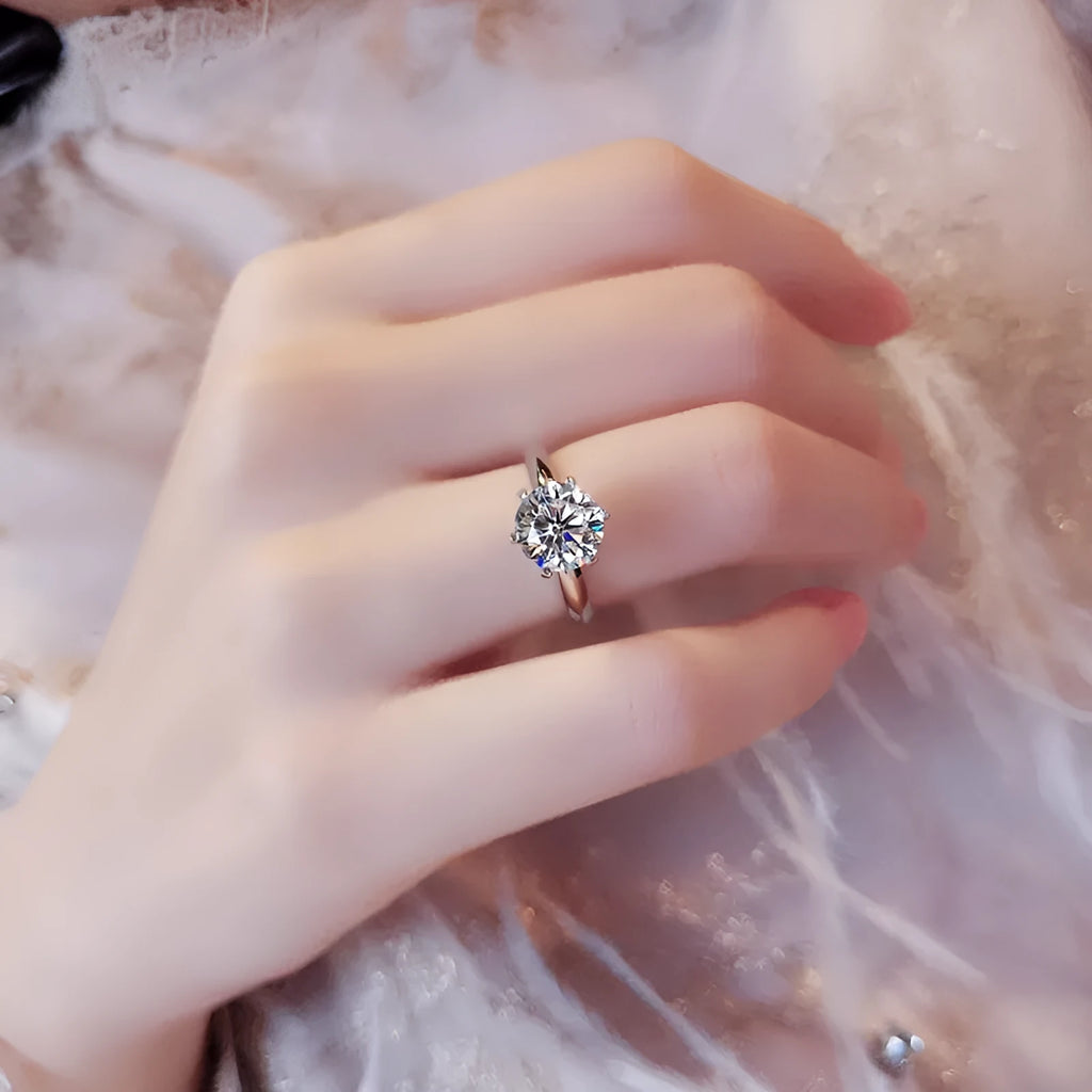 White gold plated zircon ring with six-claw geometric setting on white copper base