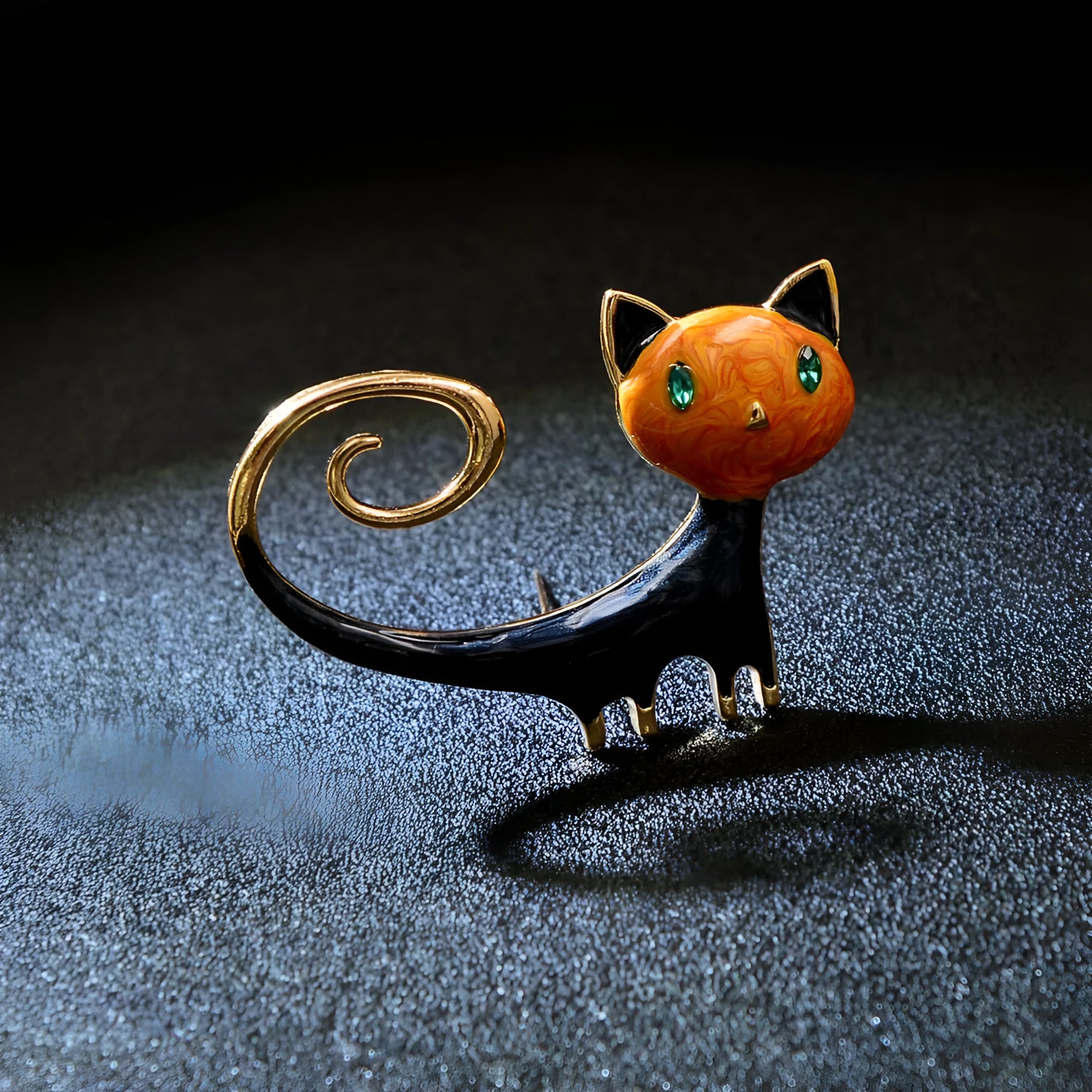 Close-up of a white painted cat tail brooch made from alloy metal.