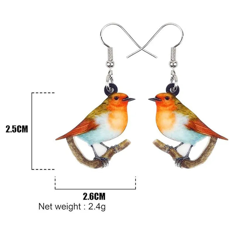 Blue Titmouse bird pendant acrylic earrings with geometric shapes and snake zodiac motifs.