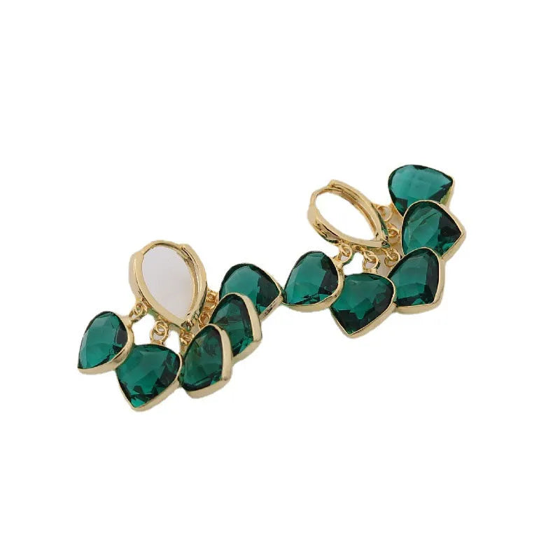 Korean style women's green heart ear clip earrings with alloy inlay gemstone.