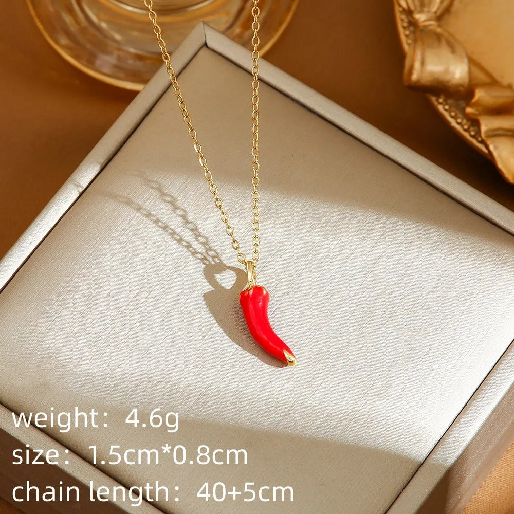 Women's titanium steel necklace with O-ring chain showing cherry, strawberry, and pepper charm options.