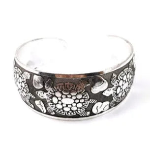 Openwork Miao ethnic carved silver bracelet with elephant or turtle motifs