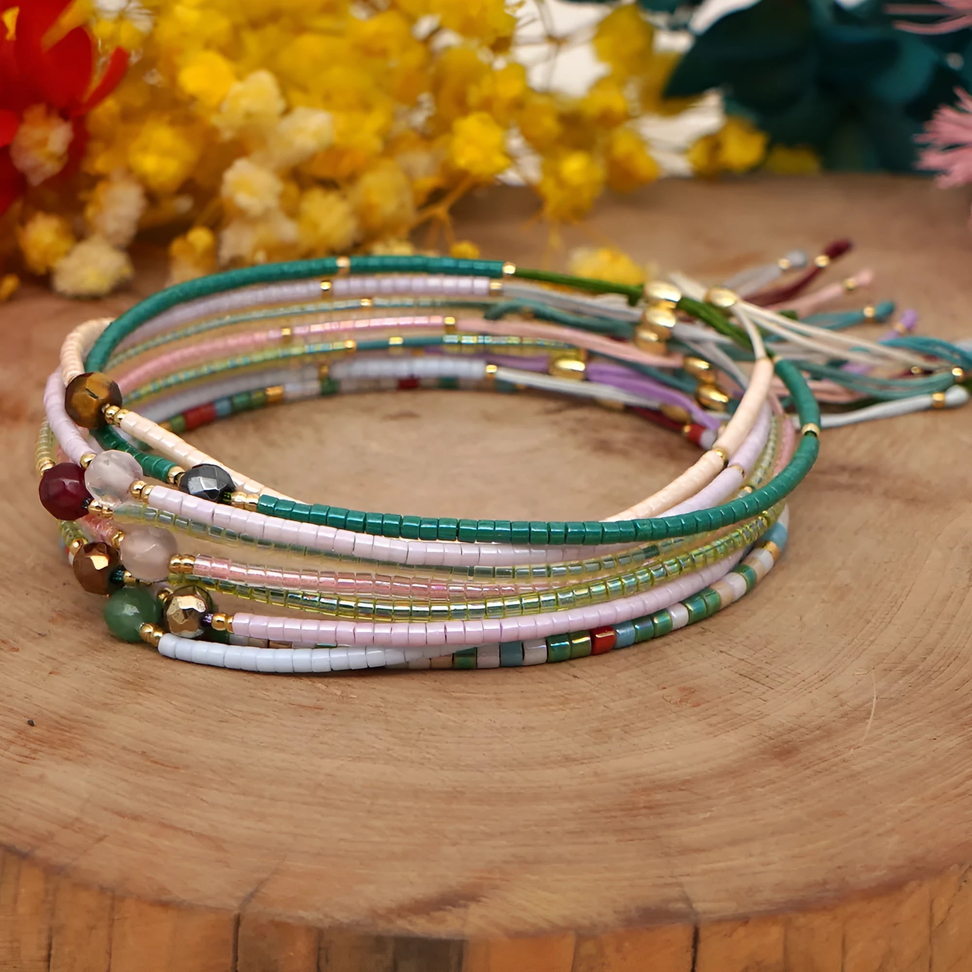Women's handmade colourful beaded bracelet with geometric glass beads on adjustable cord