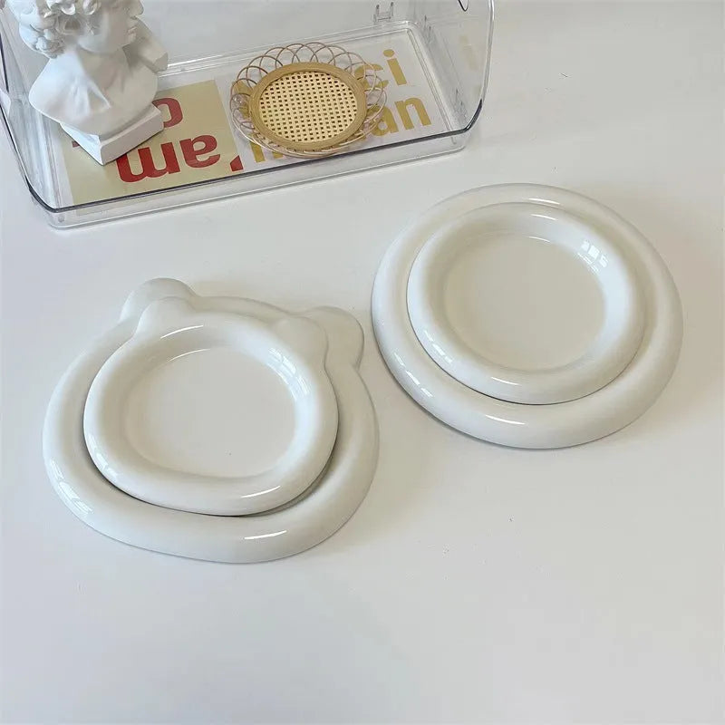 White porcelain chubby toot plate with bear doodle design, suitable for microwave use