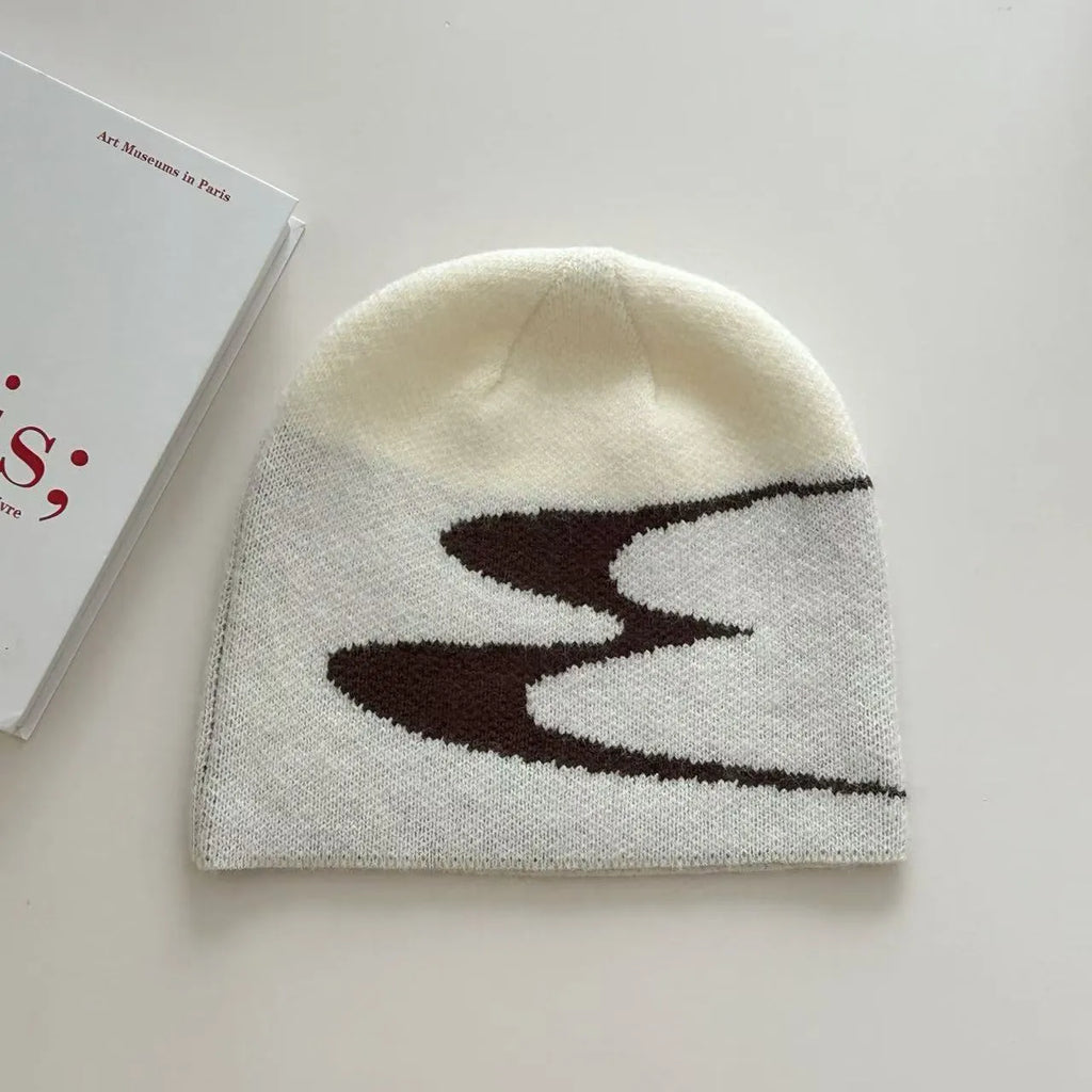 A black knitted acrylic beanie hat for men and women, size M for winter.