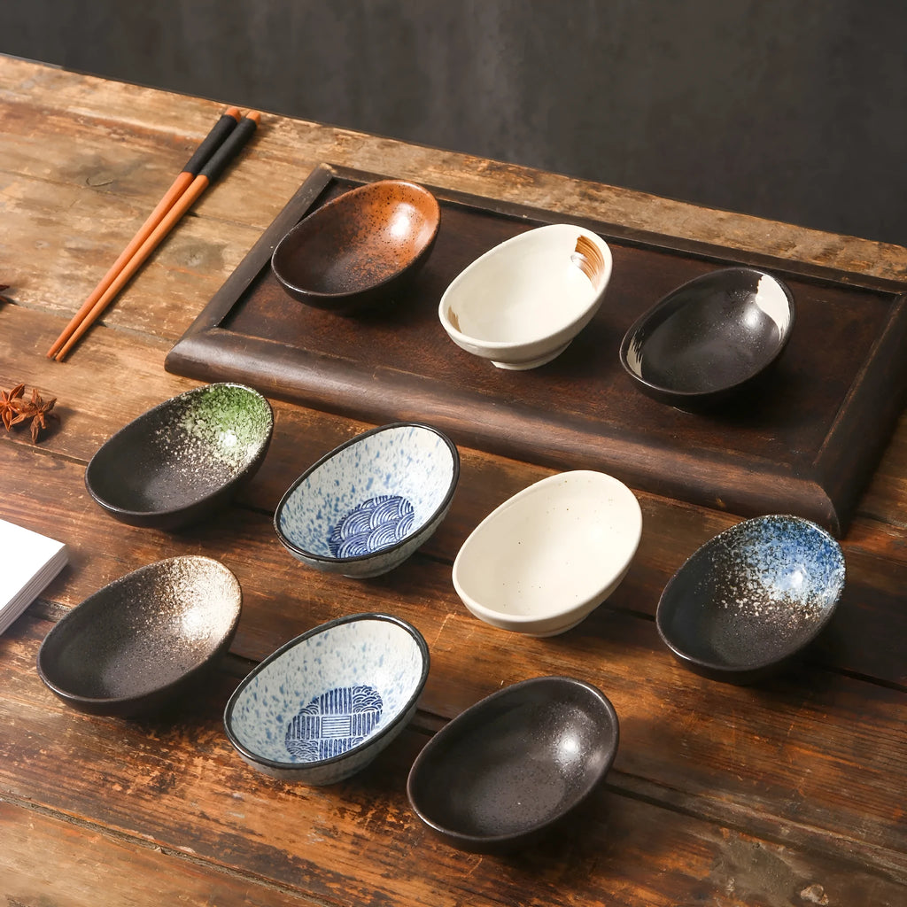 Oval Japanese ceramic sauce dipping bowl with underglaze finish in decorative pattern