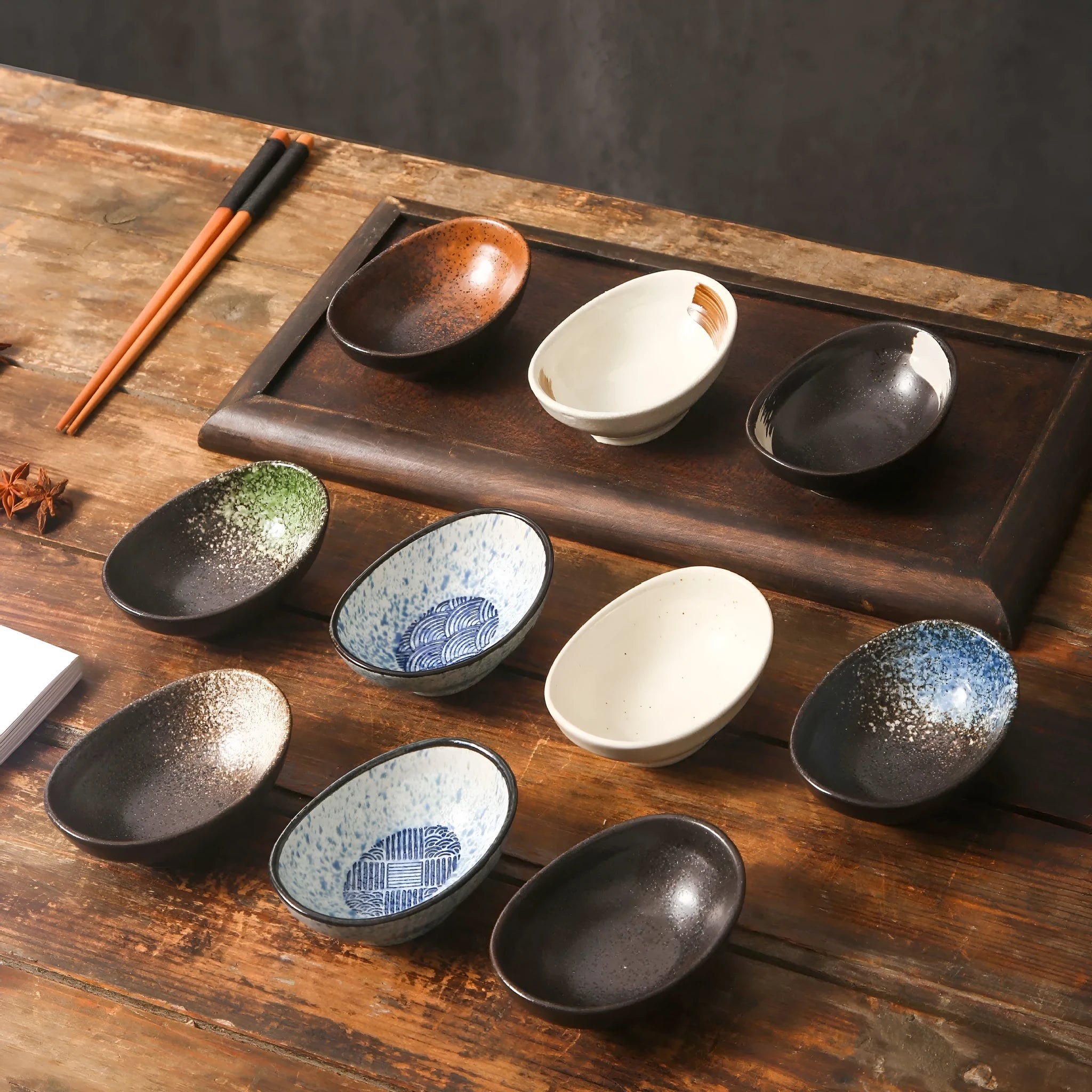 Oval Japanese ceramic sauce dipping bowl with underglaze finish in decorative pattern