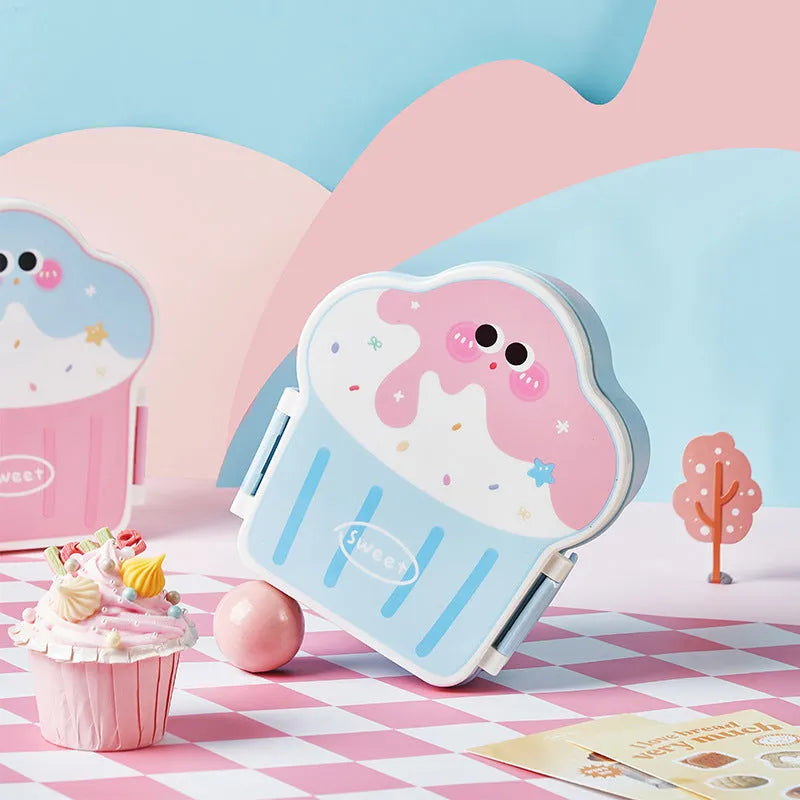 Pink and blue cartoon-style ice cream shaped plastic lunch boxes with spoons and forks.