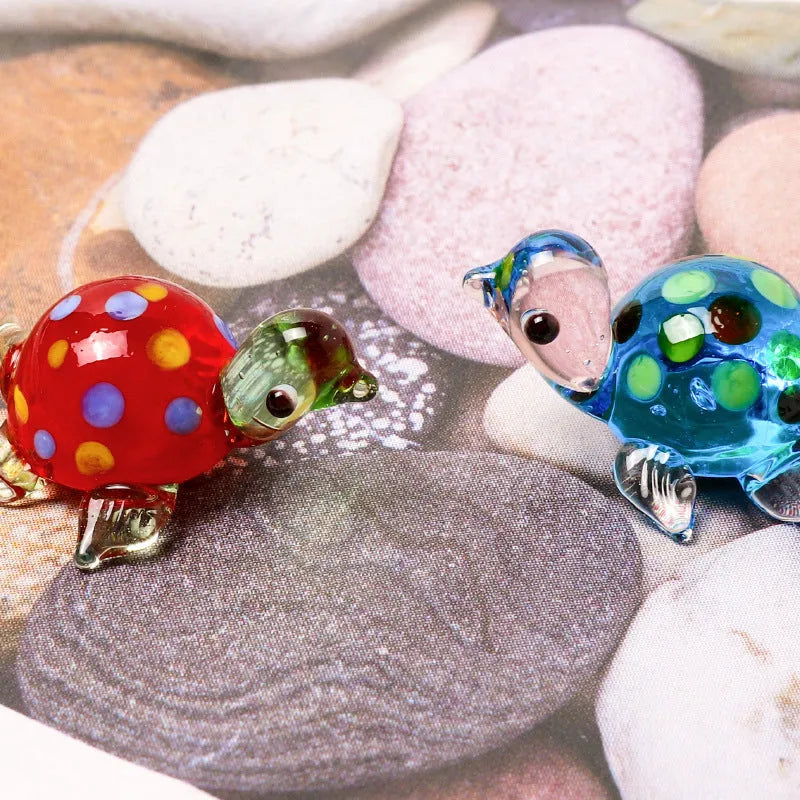 Geometric glass turtle desktop ornament in modern simplicity style on a wooden surface.