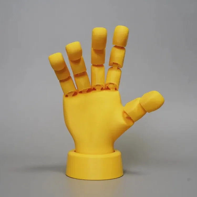 Yellow hand ornaments figurine with movable joints measuring 5 by 5.38 by 7.5 centimetres