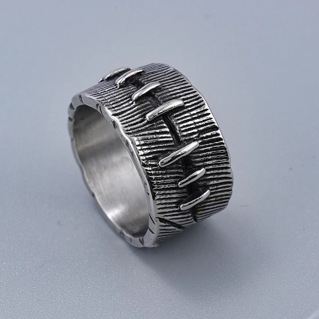 Dark punk geometric ring with double ring design and stitched detailing in retro colour on titanium steel