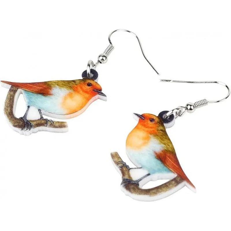Blue Titmouse bird pendant acrylic earrings with geometric shapes and snake zodiac motifs.