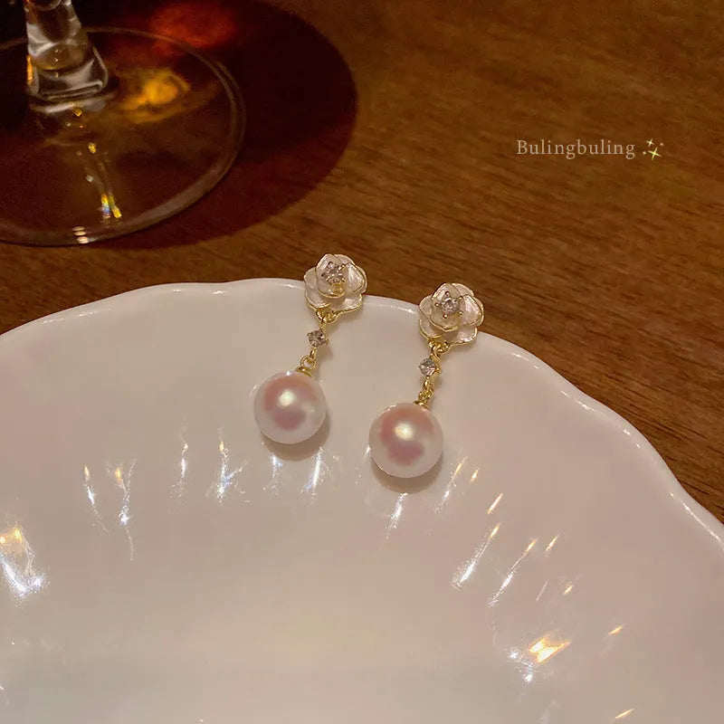 Camellia pearl flower stud earrings for women in alloy metal with floral design
