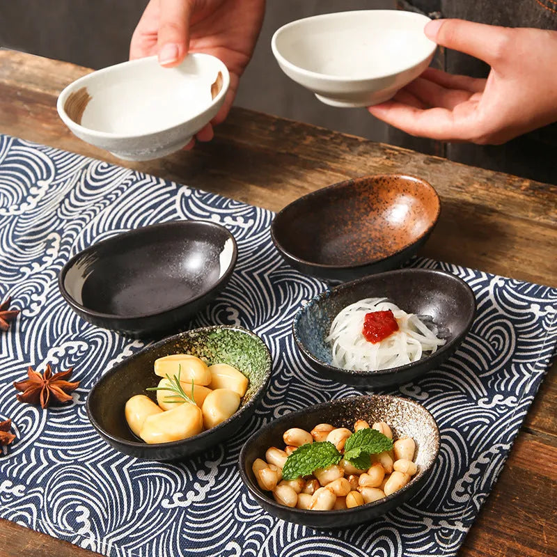 Oval Japanese ceramic sauce dipping bowl with underglaze finish in decorative pattern