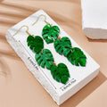 Acrylic drop earrings with coconut and jackfruit design on alloy hooks in various colour styles.
