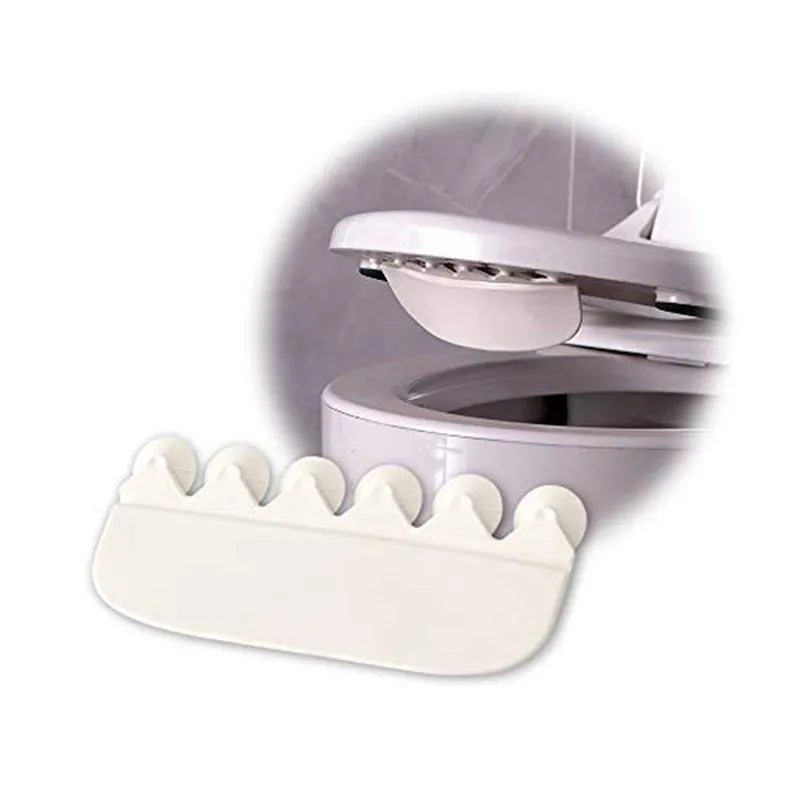 White plastic toilet urine guard for children's toilet training placed on standard toilet seat