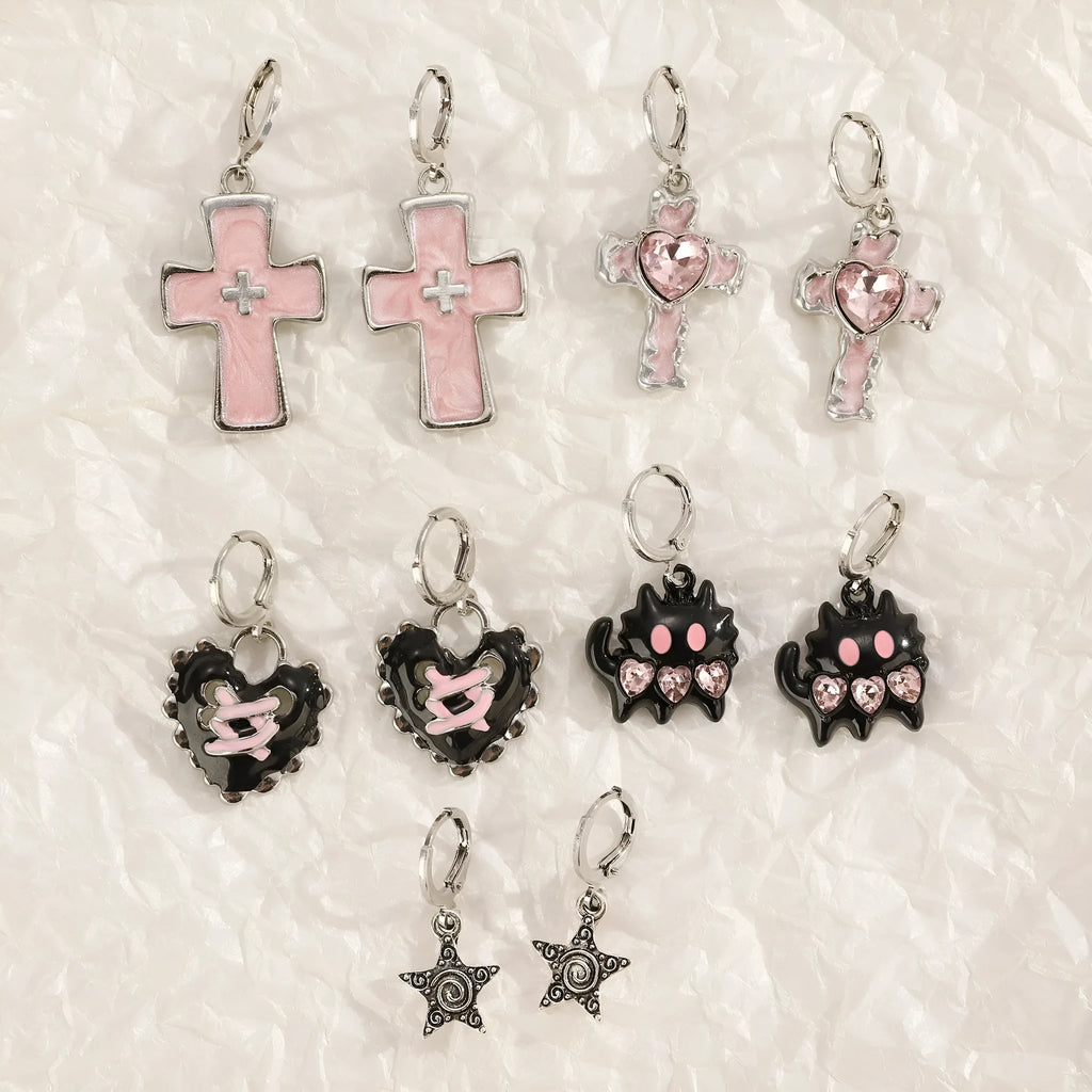 Women's alloy cross crystal earrings in five designs: white cross, peach heart, black cat, antique silver star.