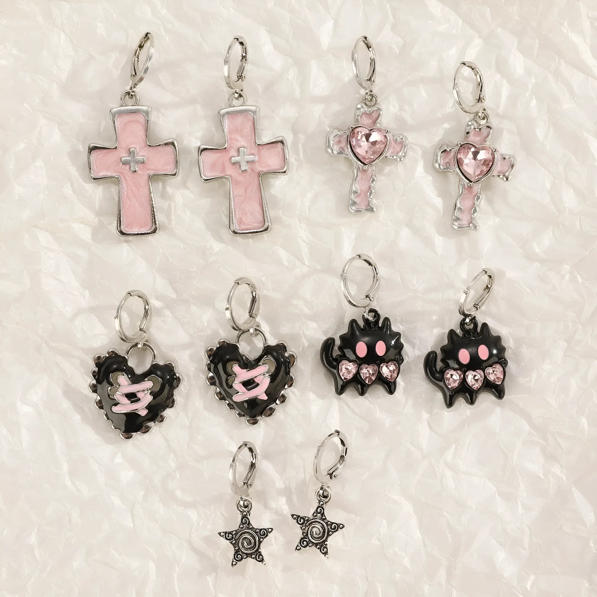 Women's alloy cross crystal earrings in five designs: white cross, peach heart, black cat, antique silver star.
