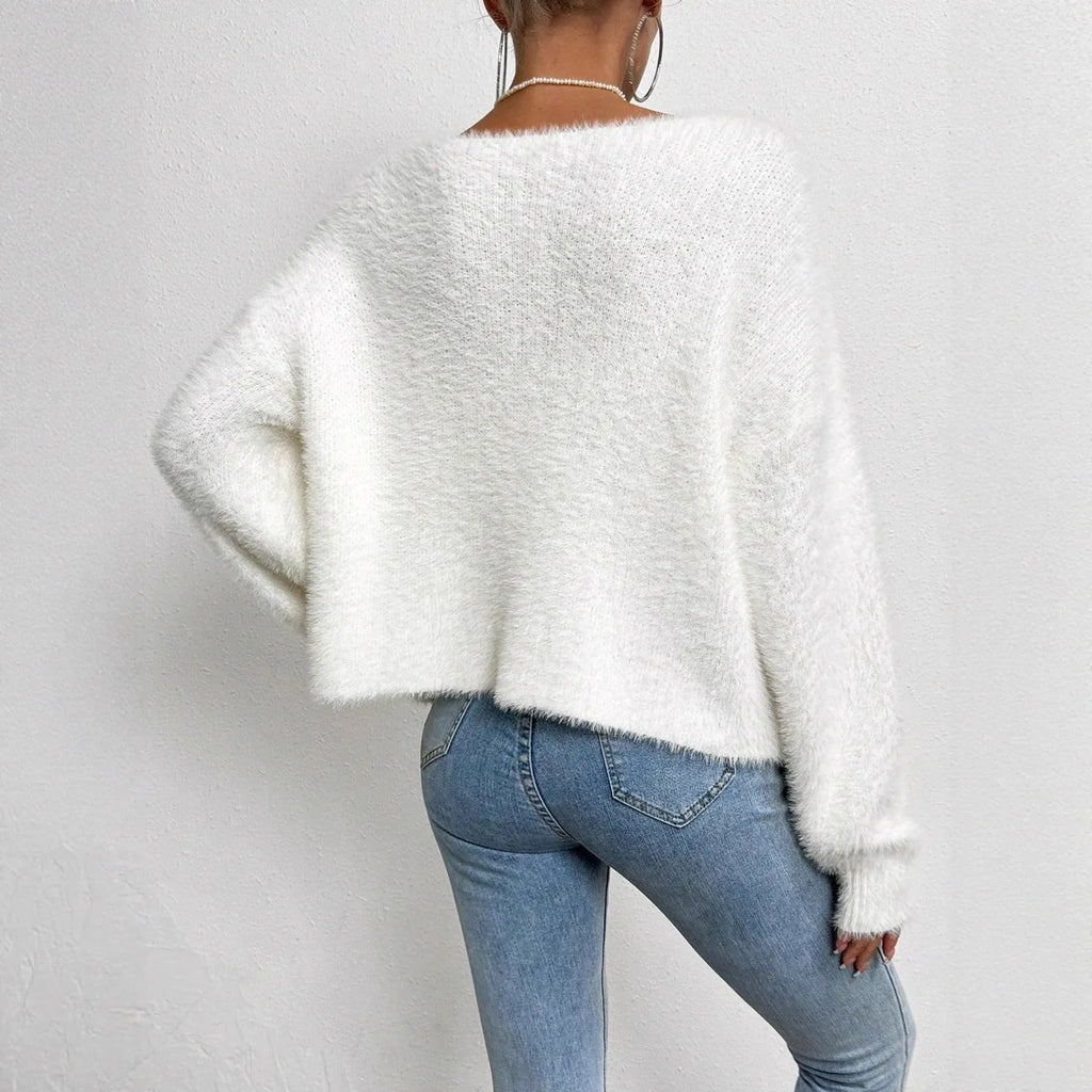 White women's V-neck cardigan with medium thickness polyester knit construction