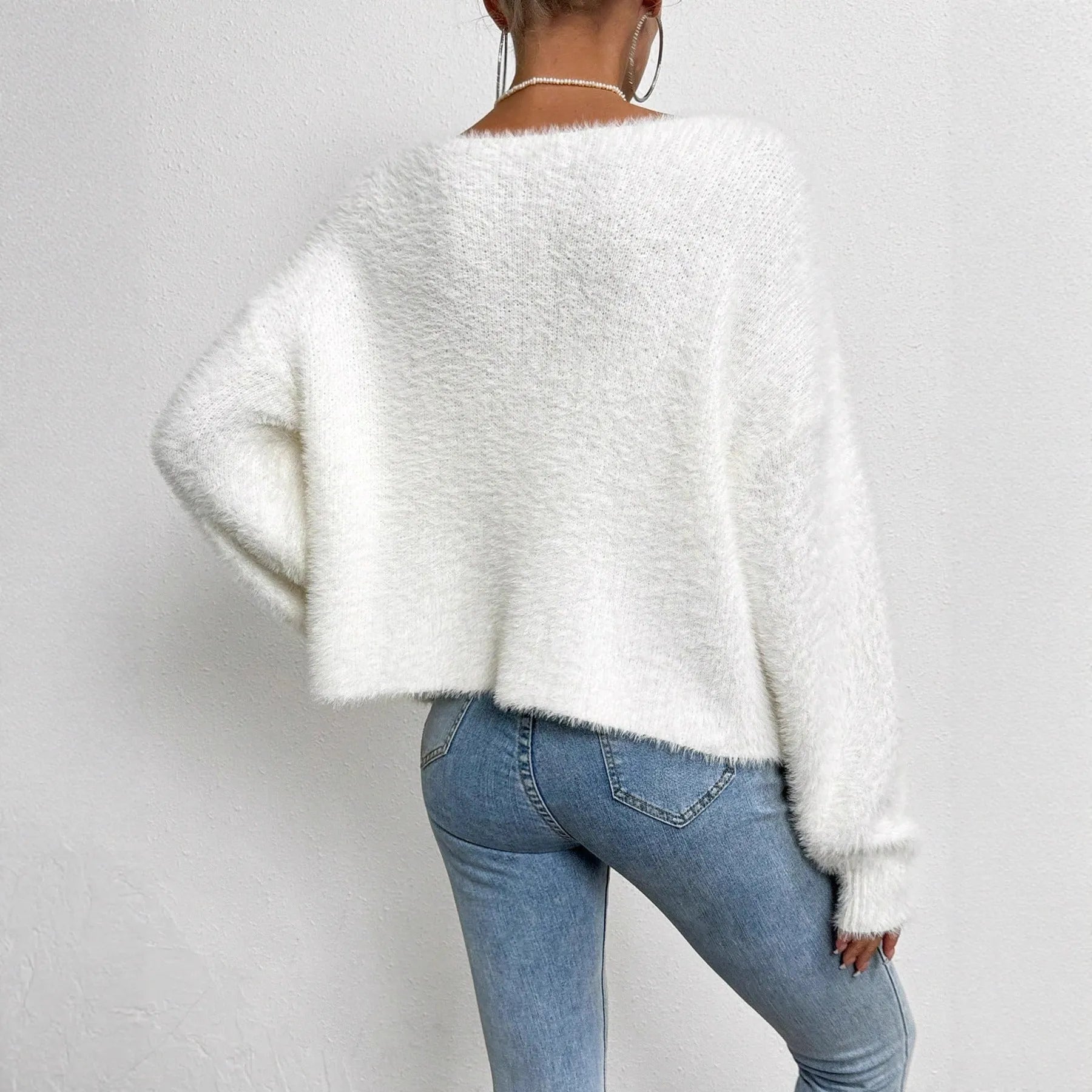 White women's V-neck cardigan with medium thickness polyester knit construction