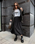 Women's solid colour cotton long skirt with elasticated waistband in black or white