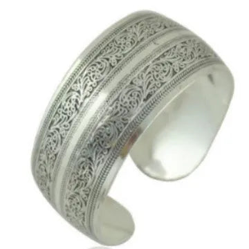 Openwork Miao ethnic carved silver bracelet with elephant or turtle motifs