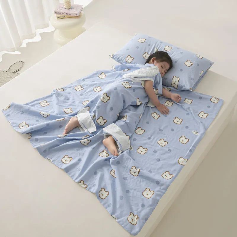 Anti-kick sleeping bag blanket in a summer design on a bed, showing its lightweight texture.