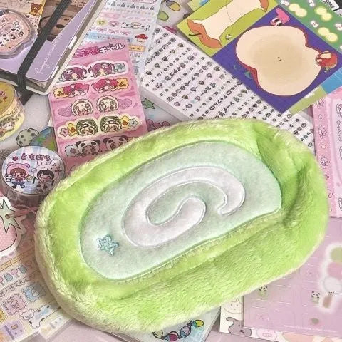 Velvet Swiss roll cake design pencil case in Korean style for stationery storage.