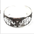 Openwork Miao ethnic carved silver bracelet with elephant or turtle motifs