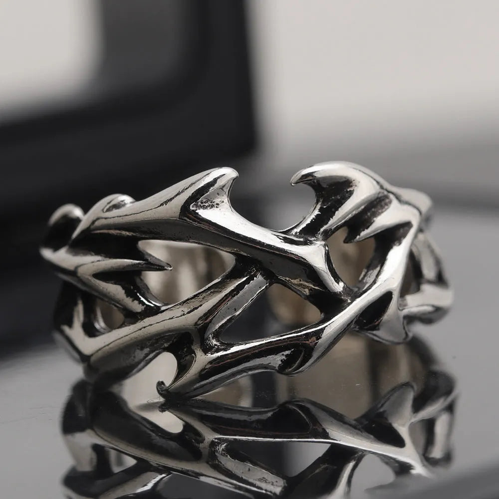 Adjustable copper men's ring with geometric thorn and flower design showing opening mechanism