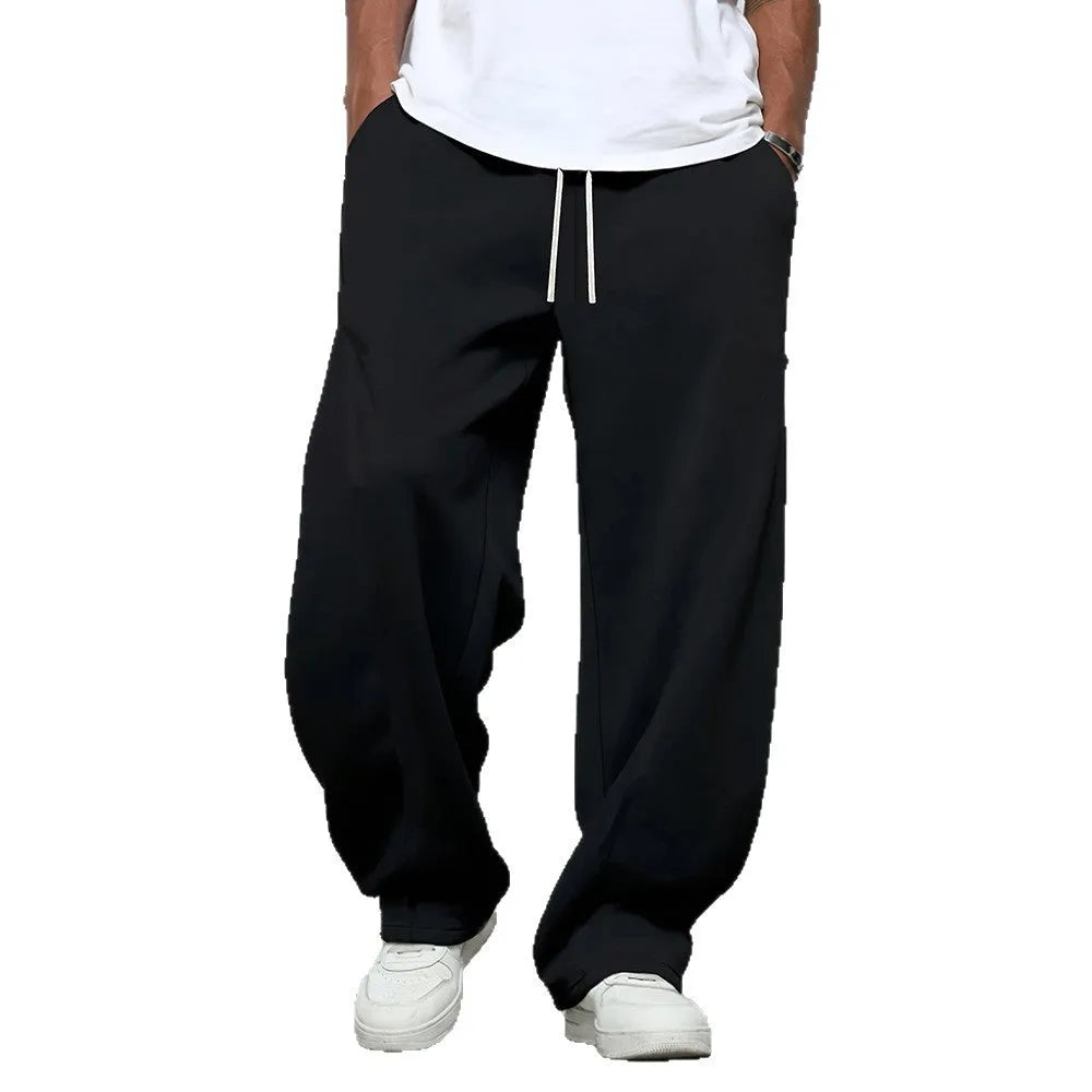 Men's straight leg casual trousers in black colour with elastic waistband and drawstring closure