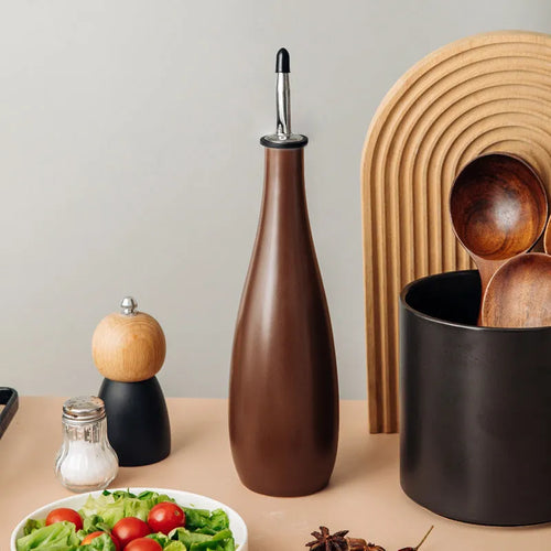 Ceramic oil pot with funnel and brush for kitchen oil storage in 650ml capacity