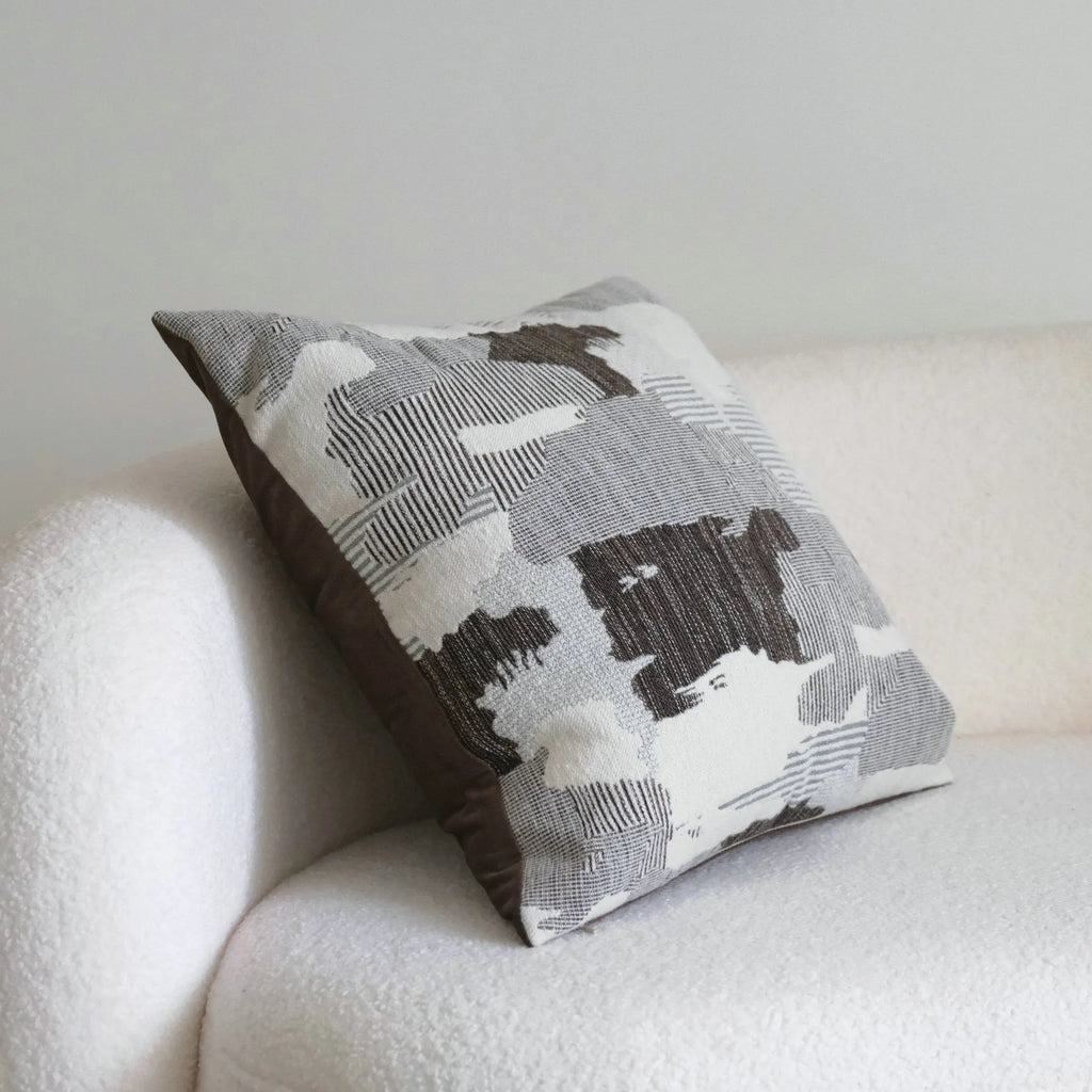 Coffee brown striped Chinese classical style decorative sofa cushion on a grey sofa.