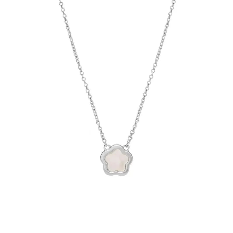 White mother-of-pearl shell flower necklace on a chain in silver or gold tone.