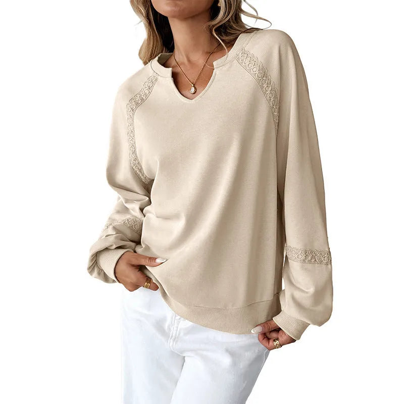 Women's loose fit long sleeve sweater with half-open collar and lace stitching detail in apricot colour.