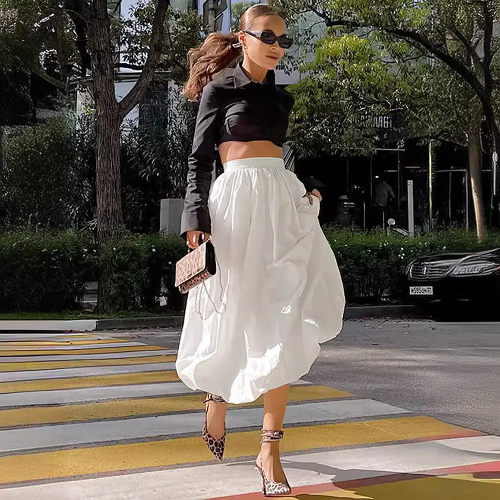 Women's solid colour cotton long skirt with elasticated waistband in black or white