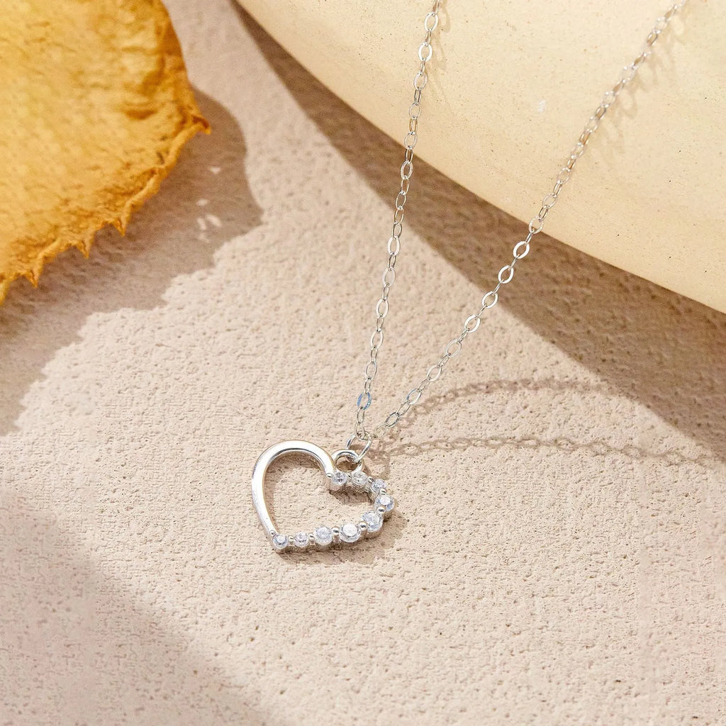 S925 sterling silver hollow heart necklace on a regular chain, shown in gold and platinum finish options.