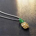 Silver pineapple charm necklace with geometric diamond design details
